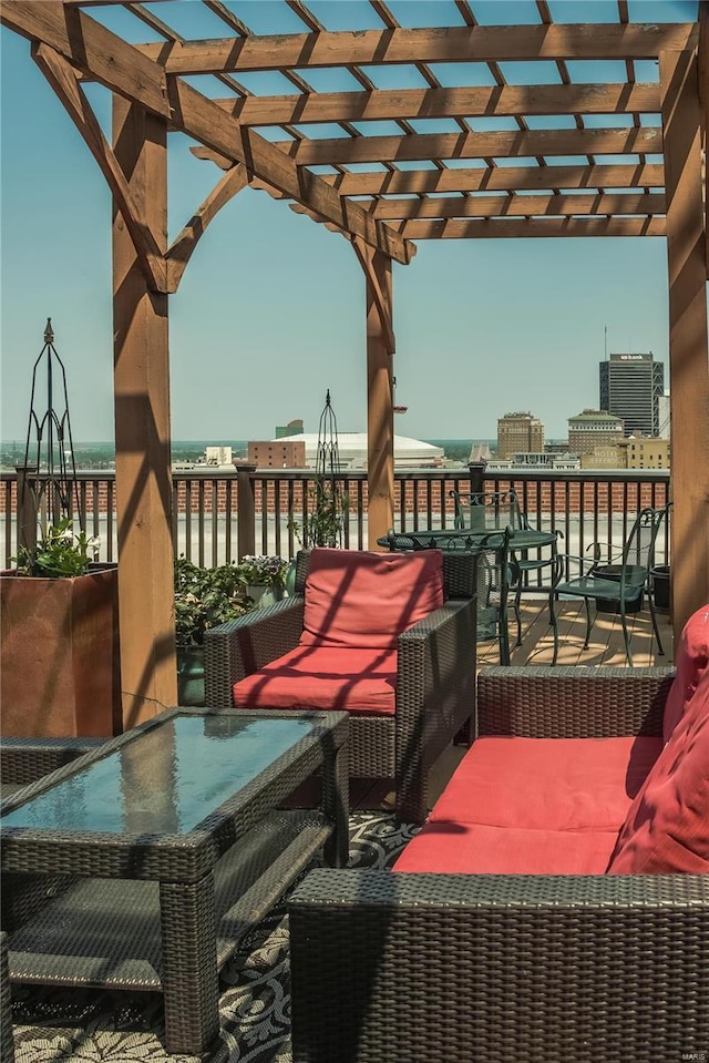 balcony featuring a pergola