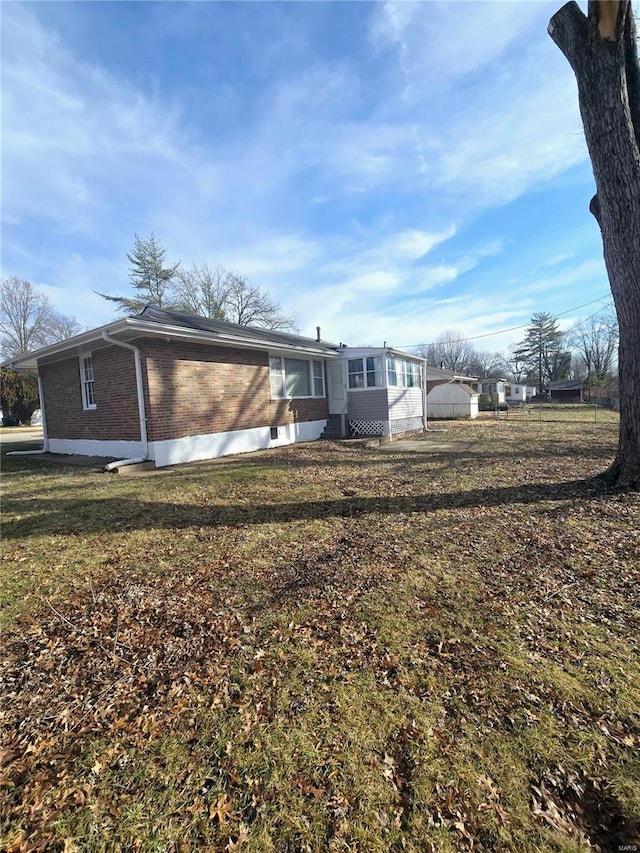 rear view of house with a yard