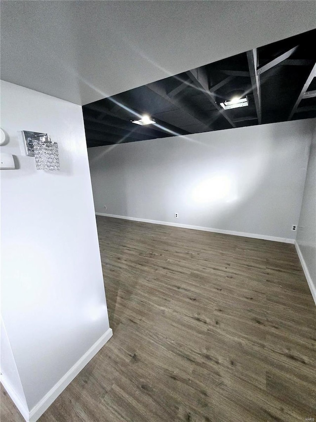 basement with dark wood-type flooring