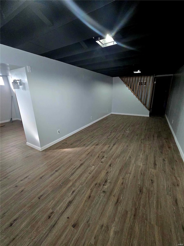 basement featuring dark wood-type flooring