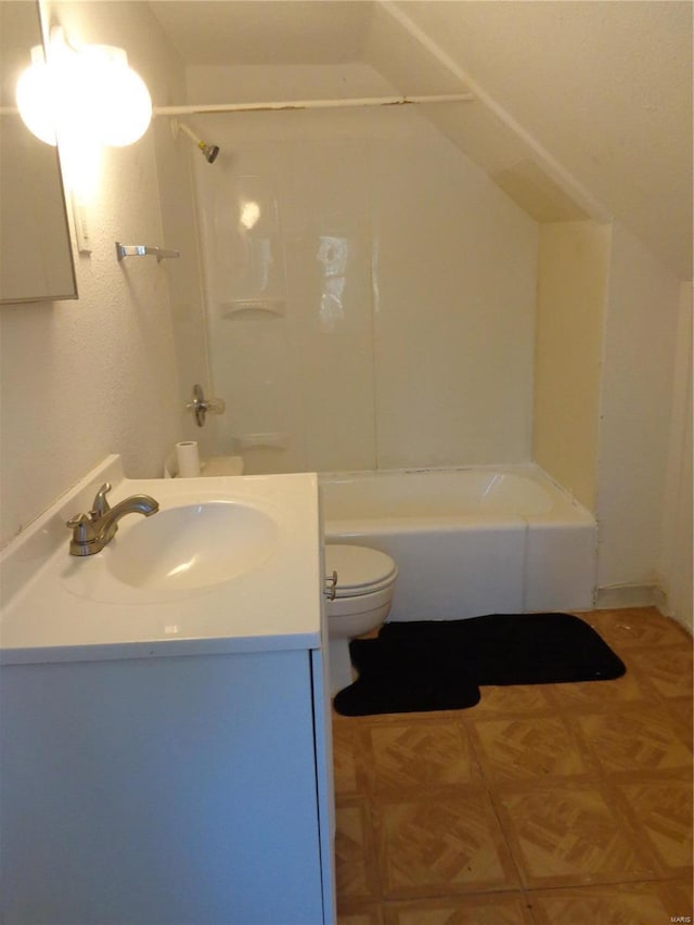 full bathroom with toilet, bathing tub / shower combination, vaulted ceiling, parquet floors, and vanity