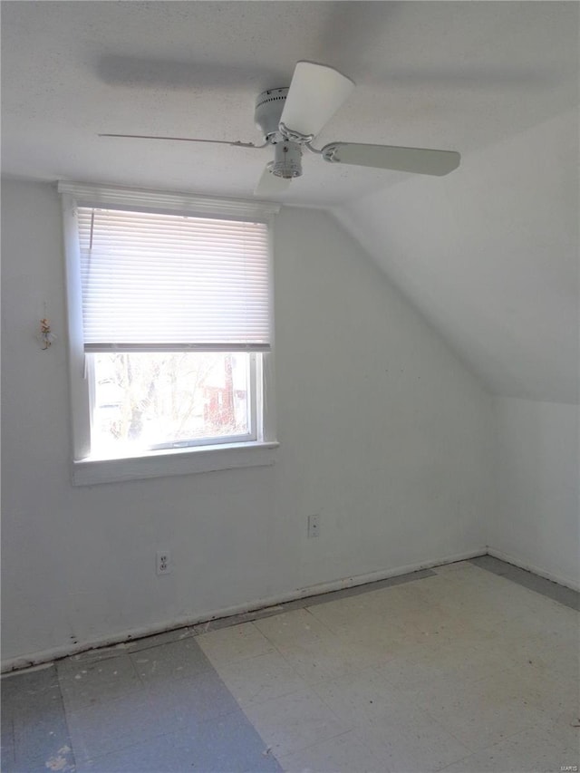 additional living space with lofted ceiling and ceiling fan