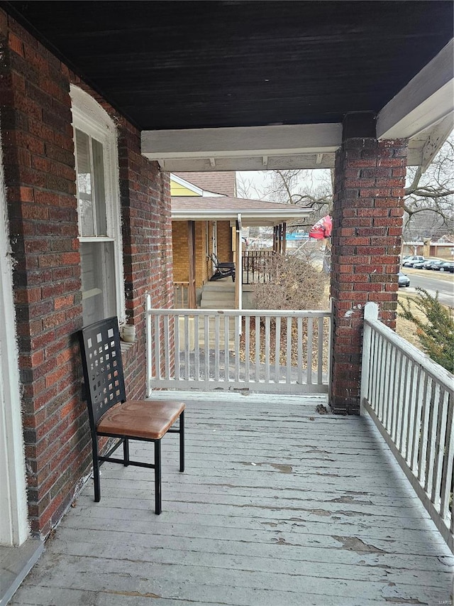 wooden deck featuring covered porch