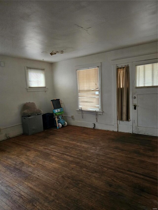 interior space with dark hardwood / wood-style flooring