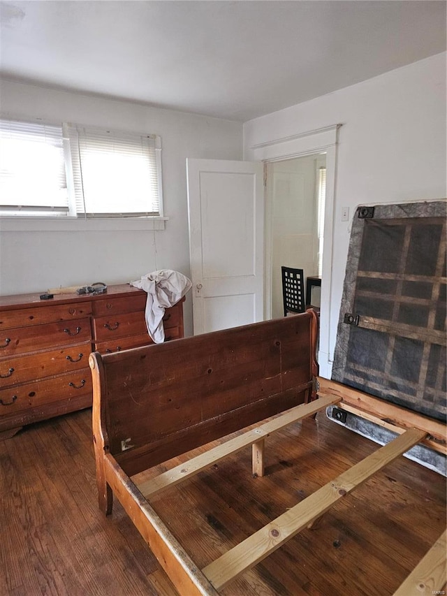 bedroom featuring dark wood-type flooring