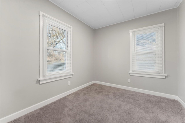 unfurnished room with light colored carpet