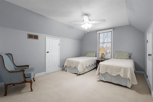 bedroom with vaulted ceiling, carpet flooring, baseboards, and visible vents