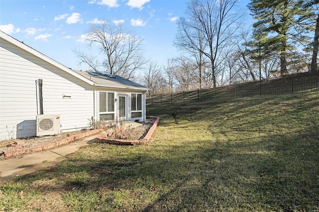 view of yard with ac unit and fence