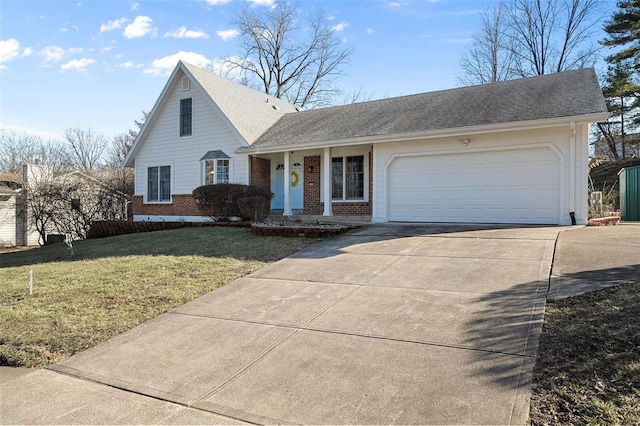 view of front of property with roof with shingles, concrete driveway, a front yard, an attached garage, and brick siding