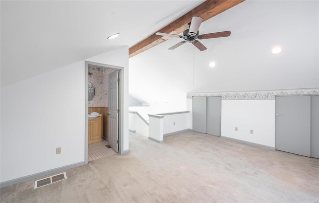 additional living space with recessed lighting, visible vents, vaulted ceiling with beams, light colored carpet, and ceiling fan