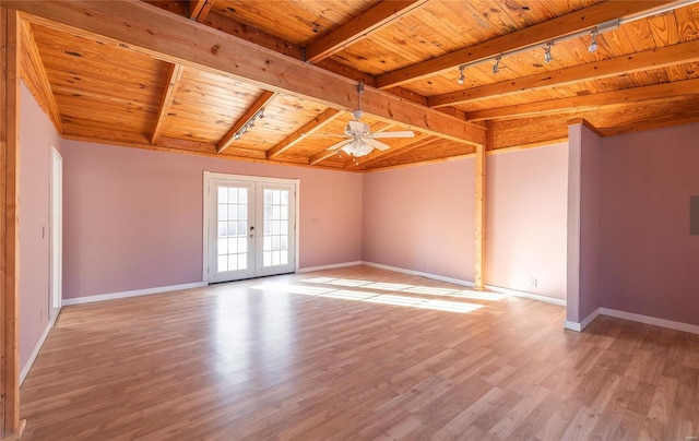 spare room featuring track lighting, a ceiling fan, french doors, wood ceiling, and light wood-style flooring