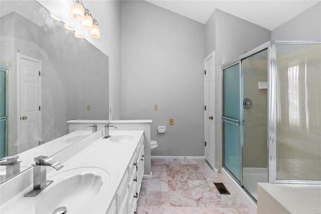 bathroom with vanity, toilet, and walk in shower