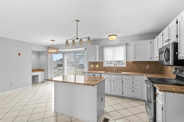 kitchen featuring sink, white cabinetry, a kitchen island, pendant lighting, and stainless steel appliances