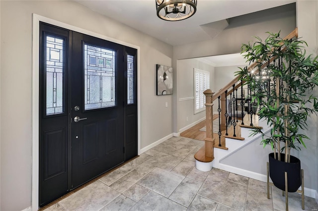 foyer entrance featuring a chandelier