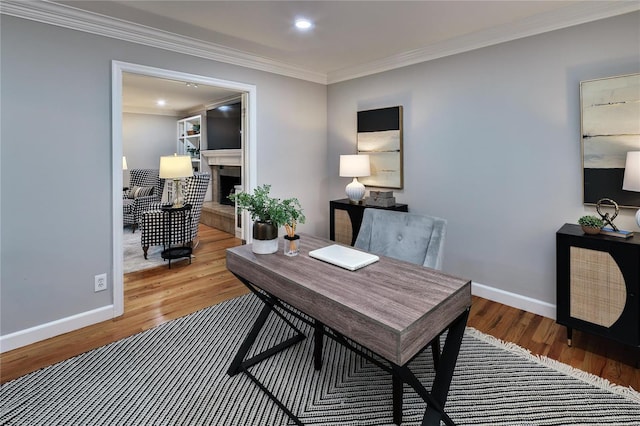 office area featuring hardwood / wood-style flooring and ornamental molding