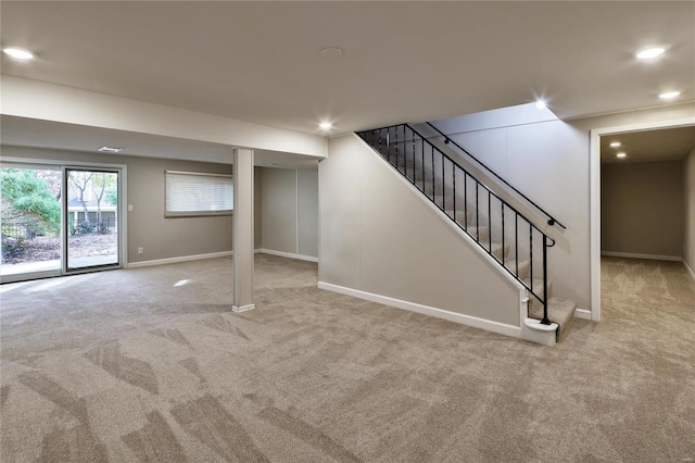 basement featuring light carpet