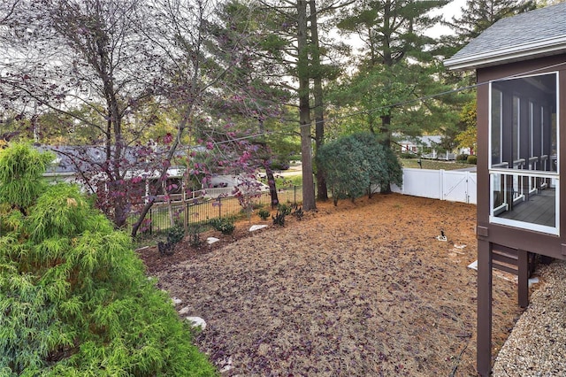 view of yard featuring a sunroom