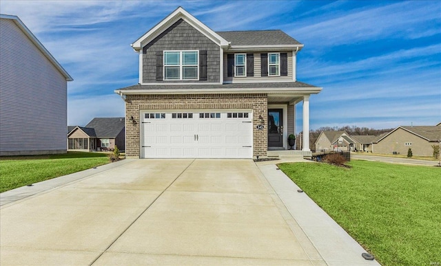 view of front of property with a garage and a front lawn