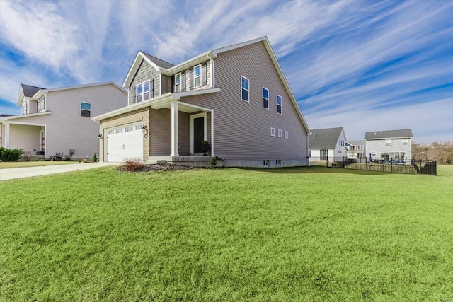 view of front of home with a garage and a front yard