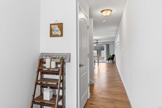 corridor featuring hardwood / wood-style floors