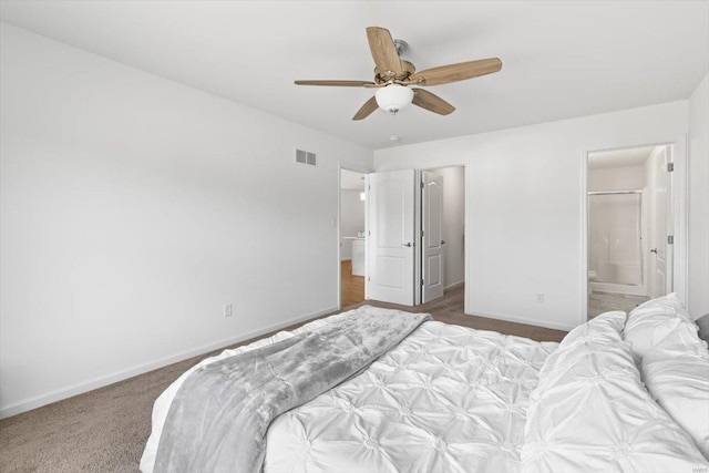 carpeted bedroom with connected bathroom and ceiling fan