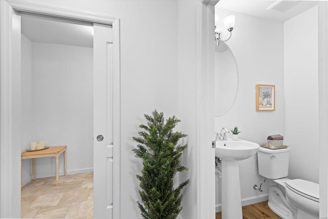 bathroom with toilet and sink