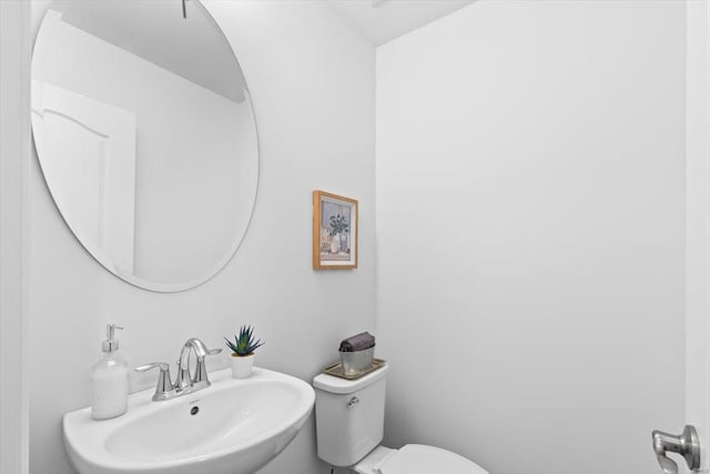 bathroom with sink and toilet