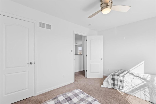 carpeted bedroom featuring ceiling fan