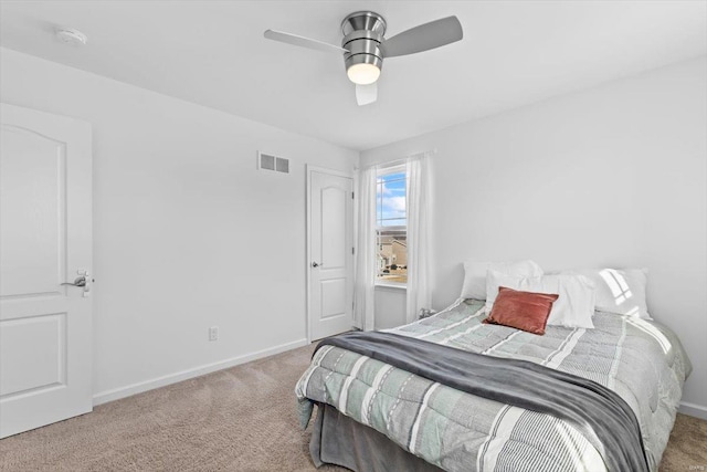 bedroom with light colored carpet and ceiling fan