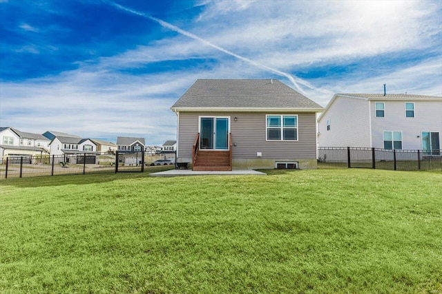 rear view of property with a patio and a lawn