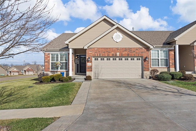 view of front of property with a garage and a front lawn