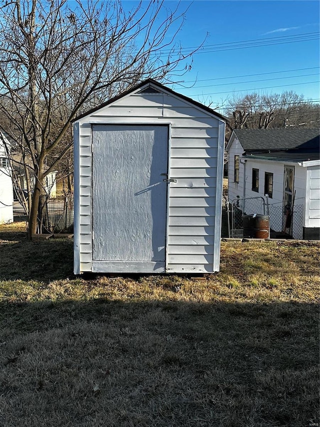 view of outdoor structure with a lawn