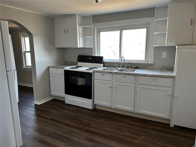 kitchen featuring white cabinetry, white fridge, electric range oven, and sink