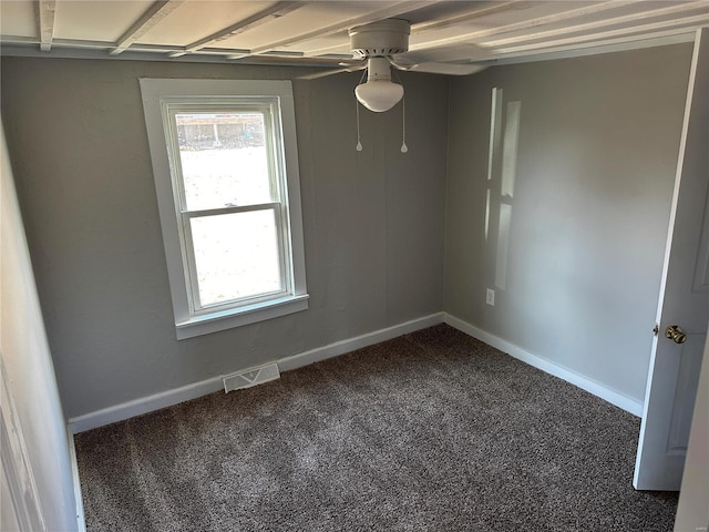 empty room with ceiling fan and carpet floors