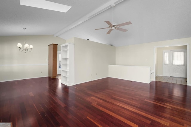 unfurnished living room featuring baseboards, lofted ceiling with skylight, wood finished floors, and ceiling fan with notable chandelier