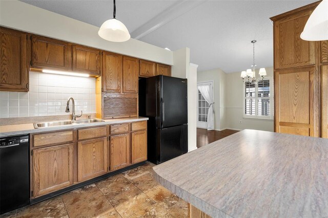 kitchen with brown cabinets, black appliances, a sink, decorative light fixtures, and tasteful backsplash