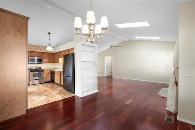 kitchen featuring black appliances, vaulted ceiling with skylight, brown cabinetry, and light wood-style flooring