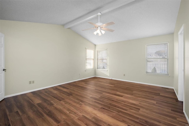 spare room featuring vaulted ceiling with beams, wood finished floors, and baseboards