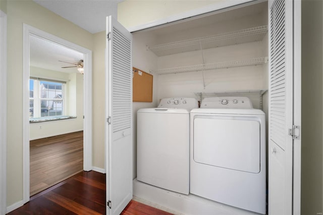 laundry area featuring baseboards, washing machine and clothes dryer, laundry area, dark wood-style flooring, and ceiling fan