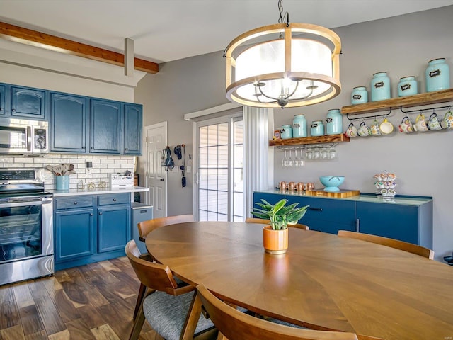 dining room featuring dark wood finished floors and beamed ceiling