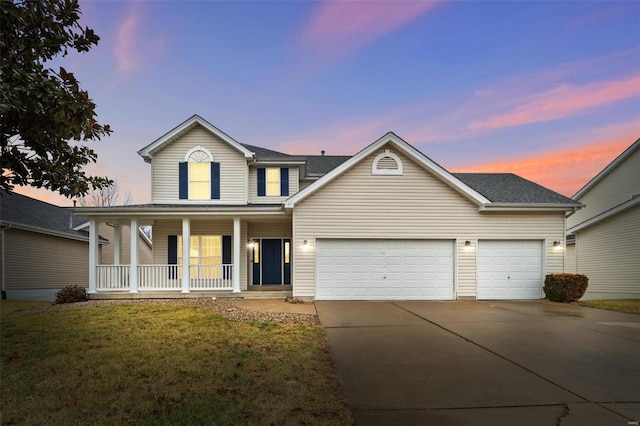 view of front of house featuring a porch, a garage, and a yard