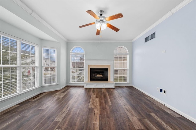 unfurnished living room featuring dark hardwood / wood-style flooring, crown molding, and ceiling fan