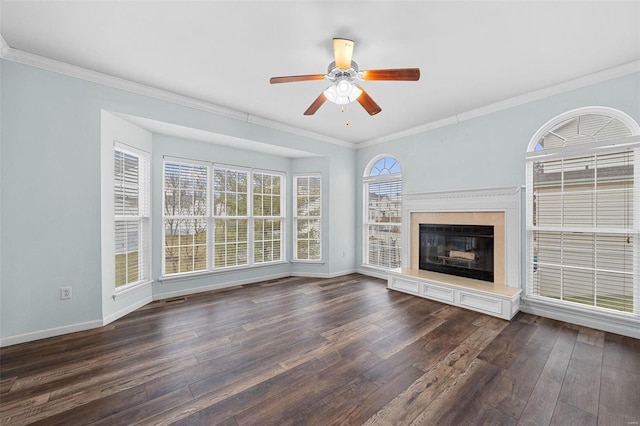 unfurnished living room featuring dark wood-type flooring, ceiling fan, and crown molding