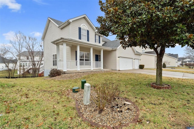 view of front of house featuring a garage, a front yard, and a porch