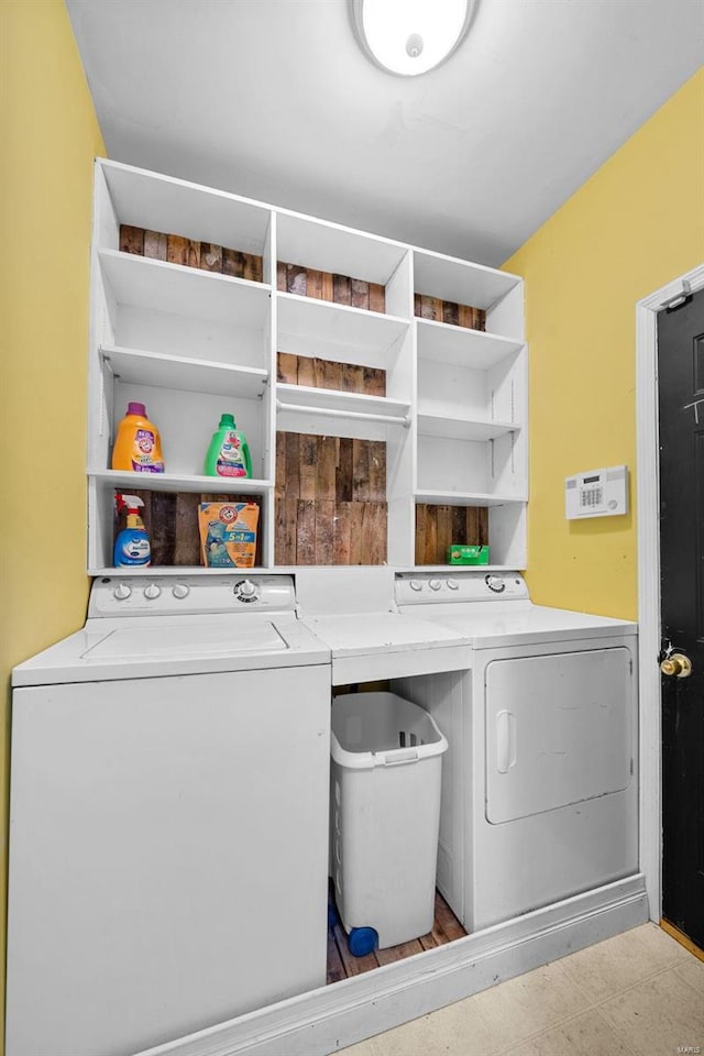 clothes washing area featuring washing machine and dryer