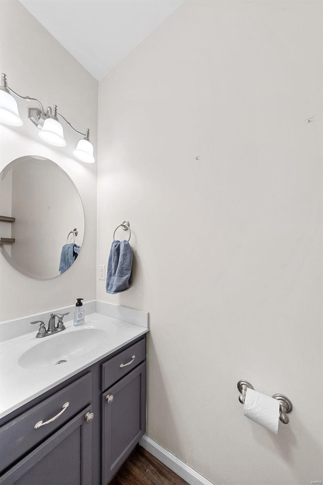 bathroom featuring vanity and hardwood / wood-style flooring