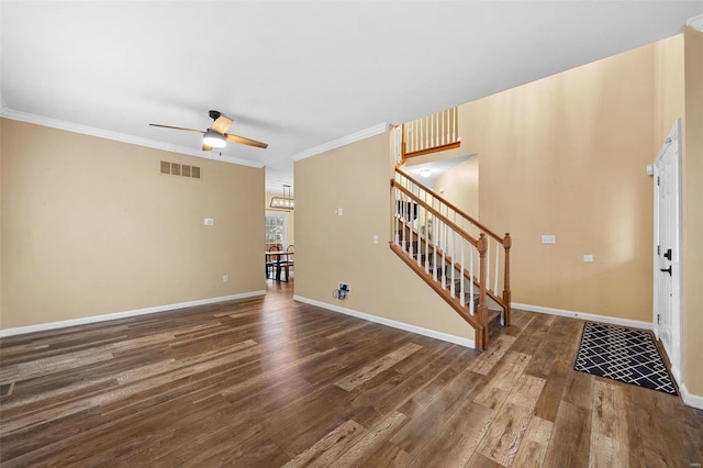 interior space featuring crown molding, dark wood-type flooring, and ceiling fan