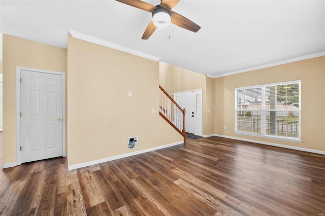 unfurnished living room featuring crown molding, dark wood-type flooring, and ceiling fan