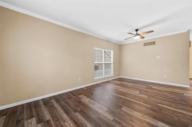 unfurnished room with crown molding, ceiling fan, and dark hardwood / wood-style flooring