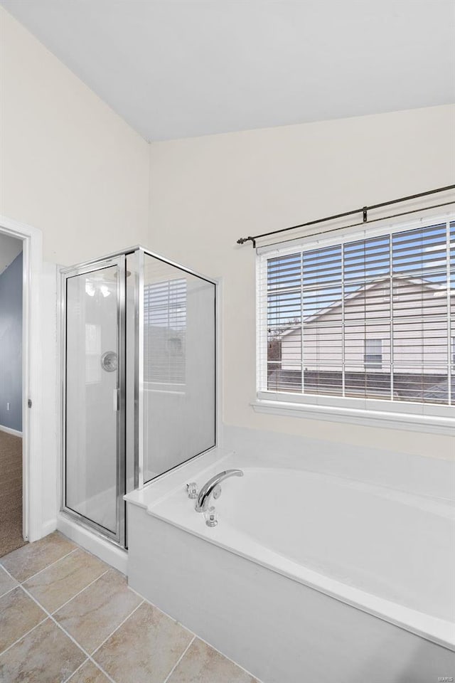 bathroom featuring separate shower and tub and tile patterned flooring